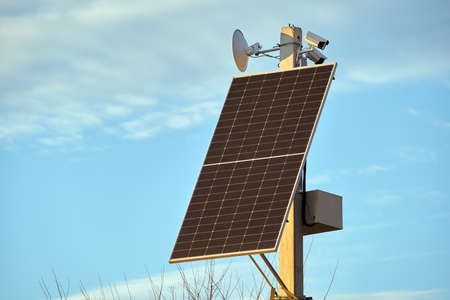Solar photovoltaic panels mounted on city street pole for electricity supply of streetlights and...