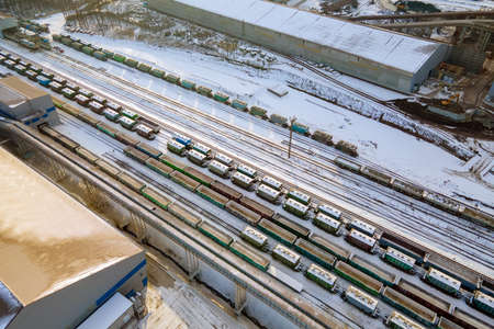 Aerial view of cargo train loaded with crushed sandstone materials at mine factory. Railway transportation of open pit mining oreの写真素材