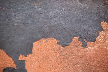 Old wall texture with cracked peeling paint. Abstract grunge backdrop