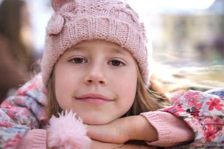 Portrait of cute little child girl in pink hatの写真素材