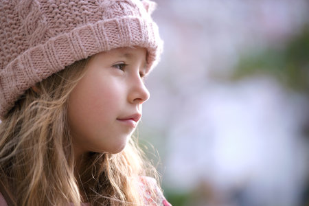 Portrait of cute little child girl in pink hatの写真素材