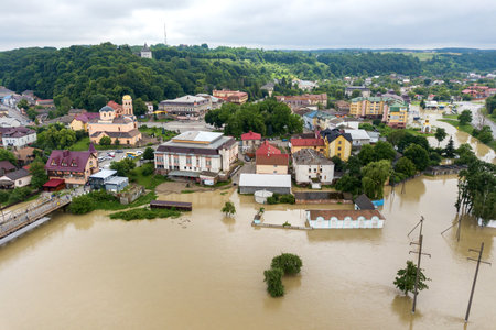 Aerial view of flooded houses with dirty water of Dnister river in Halych town, western Ukraineの写真素材