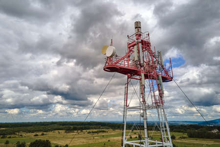 Aerial view of telecommunications cell phone tower with wireless communication antennas for network signal transmissionの写真素材