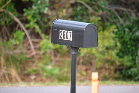 Typical american outdoors mail box on suburban street side