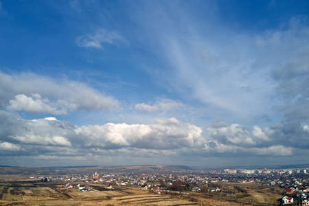 Aerial view from high altitude of earth covered with puffy rainy clouds forming before rainstorm