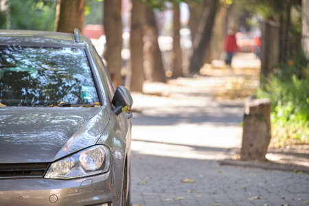 Close up of a car parked illegally against traffic rules on pedestrian city street side
