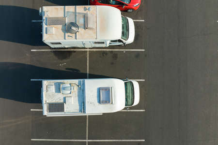 Aerial view of camper vans parked on parking lotの写真素材