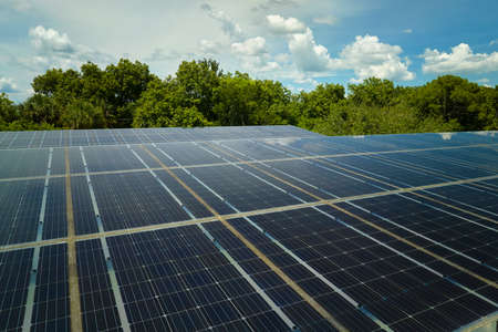 Solar panels installed over parking lot for parked cars for effective generation of clean energy
