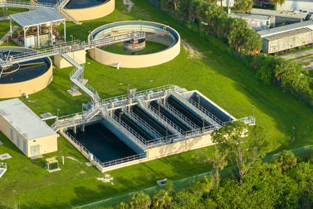 Aerial view of modern water cleaning facility at urban wastewater treatment plant. Purification...