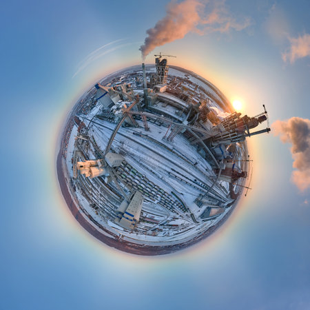Aerial view from high altitude of little planet earth with cement factory tower with high concrete...