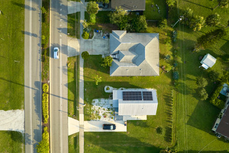 Aerial view of street traffic with driving cars in small town America suburban landscape with...