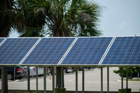Solar panels installed on stand frame near parking lot for effective generation of clean...
