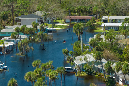 Surrounded by hurricane Ian rainfall flood waters homes in Florida residential area. Consequences of natural disasterの写真素材