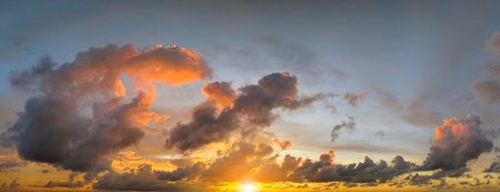 Colofrul clouds brightly illuninated by setting sun on evening sky. Changing cloudscape weather at...