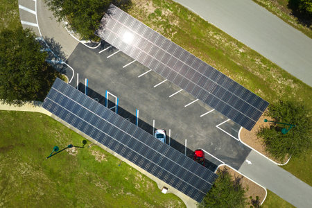 Solar panels installed over parking lot for parked cars for effective generation of clean energy