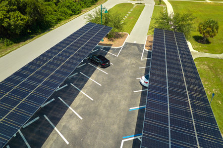 Solar panels installed over parking lot for parked cars for effective generation of clean energy