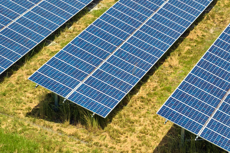 Aerial view of large sustainable electrical power plant with rows of solar photovoltaic panels for producing clean electric energy. Concept of renewable electricity with zero emissionの写真素材