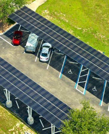 Solar panels installed over parking lot for parked cars for effective generation of clean energy