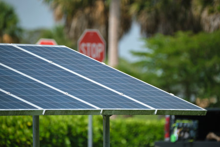 Solar panels installed on stand frame near parking lot for effective generation of clean...