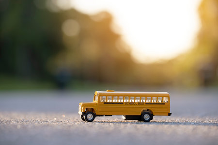 Model of classical american yellow school bus for transporting of kids to and from school every day. Concept of education in the USAの写真素材