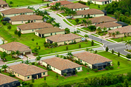 View from above of densely built residential houses in closed living clubs in south Florida. American dream homes as example of real estate development in US suburbsの写真素材