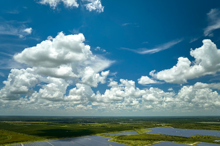 Aerial view of large sustainable electrical power plant with rows of solar photovoltaic panels for producing clean electric energy. Concept of renewable electricity with zero emissionの写真素材