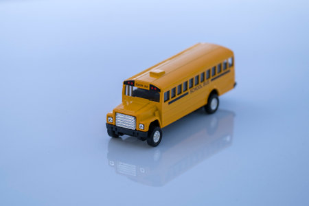 Model of classical american yellow school bus for transporting of kids to and from school every day. Concept of education in the USAの写真素材