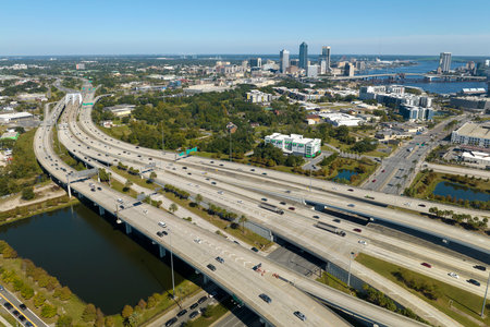 Aerial view of american freeway intersection with fast moving cars and trucks. USA transportation infrastructure conceptの写真素材