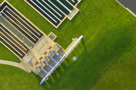 Aerial view of modern water cleaning facility at urban wastewater treatment plant. Purification process of removing undesirable chemicals, suspended solids and gases from contaminated liquidの写真素材