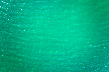 Aerial view of seascape surface of green sea water with small ripple wavesの写真素材