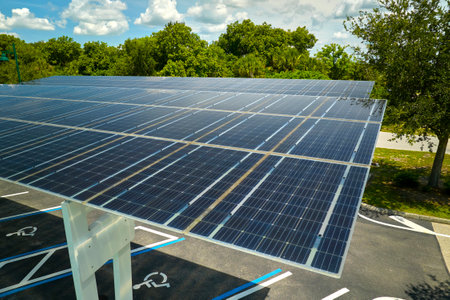 Solar panels installed over parking lot for parked cars for effective generation of clean energyの写真素材