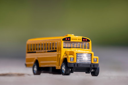 Small model of american yellow school bus as symbol of education in the USAの写真素材