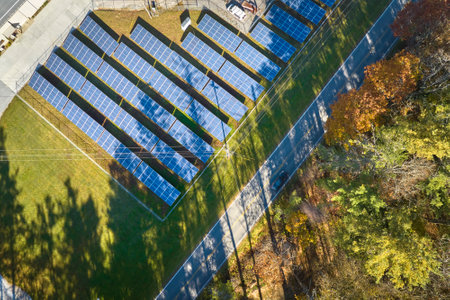 Aerial view of large sustainable electrical power plant with rows of solar photovoltaic panels for producing clean electric energy. Concept of renewable electricity with zero emissionの写真素材