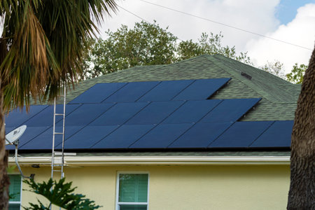Private home roof covered with solar photovoltaic panels for generating of clean ecological electric...