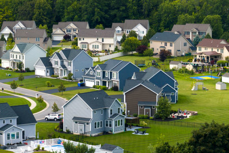 View from above of residential houses in living area in Rochester, NY. American dream homes as...