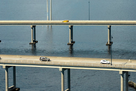 Barron Collier Bridge and Gilchrist Bridge in Florida with moving traffic. Transportation infrastructure in Charlotte County connecting Punta Gorda and Port Charlotte over Peace Riverの写真素材