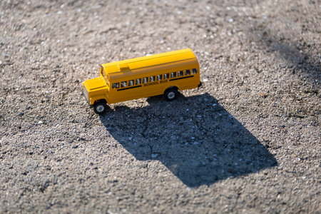 Small model of american yellow school bus as symbol of education in the USAの写真素材