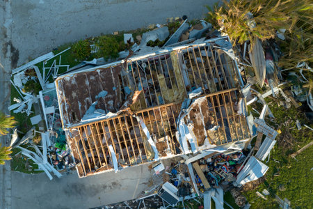 Severely damaged by hurricane Ian houses in Florida mobile home residential area. Consequences of...
