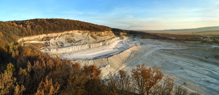 Aerial view of open pit mine of sandstone materials for construction industry with excavators and...