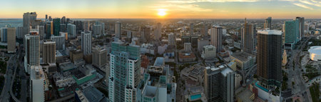 Aerial view of downtown office district of Miami Brickell in Florida, USA at sunset. High commercial and residential skyscraper buildings in modern american megapolisの写真素材