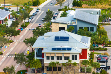 Solar rooftops in commercial center in Florida sustainable town. Photovoltaic panels for producing...