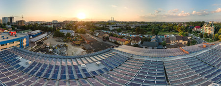 Blue photovoltaic solar panels mounted on building roof for producing clean ecological electricity...