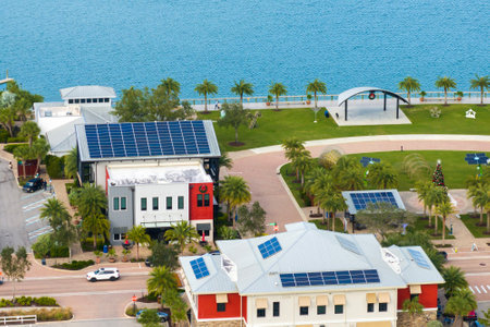 Photovoltaic panels for producing clean ecological electric energy. Florida office buildings with solar roofs. Renewable electricity with zero emission conceptの写真素材