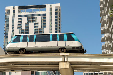 Public transportation in downtown Miami in Florida USA. Metrorail city train car on high railroad...