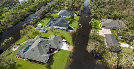 Surrounded by hurricane Ian rainfall flood waters homes in Florida residential area. Aftermath of natural disasterの写真素材