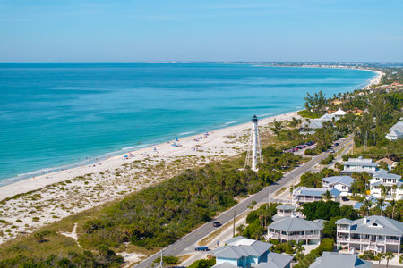 American waterfront houses and white lighthouse in island small town Boca Grande on Gasparilla...