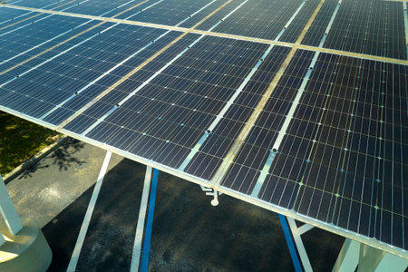 Solar panels installed over parking lot for parked cars for effective generation of clean energy
