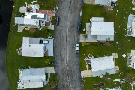 Wind damage of private houses after hurricane swept through Florida mobile home residential area. Consequences of natural disasterの写真素材