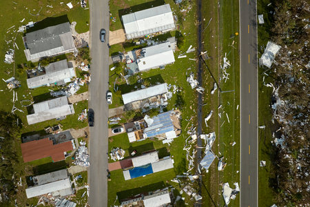 Destroyed by hurricane Ian suburban houses in Florida mobile home residential area. Consequences of...