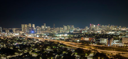 Aerial view of american highway junction at night with fast driving vehicles in Miami, Florida. View from above of USA transportation infrastructureの写真素材